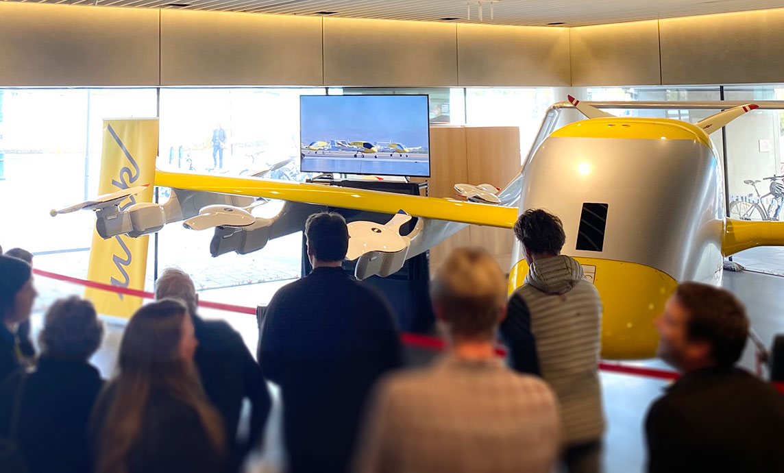 People visiting the Cora aircraft static display at the 