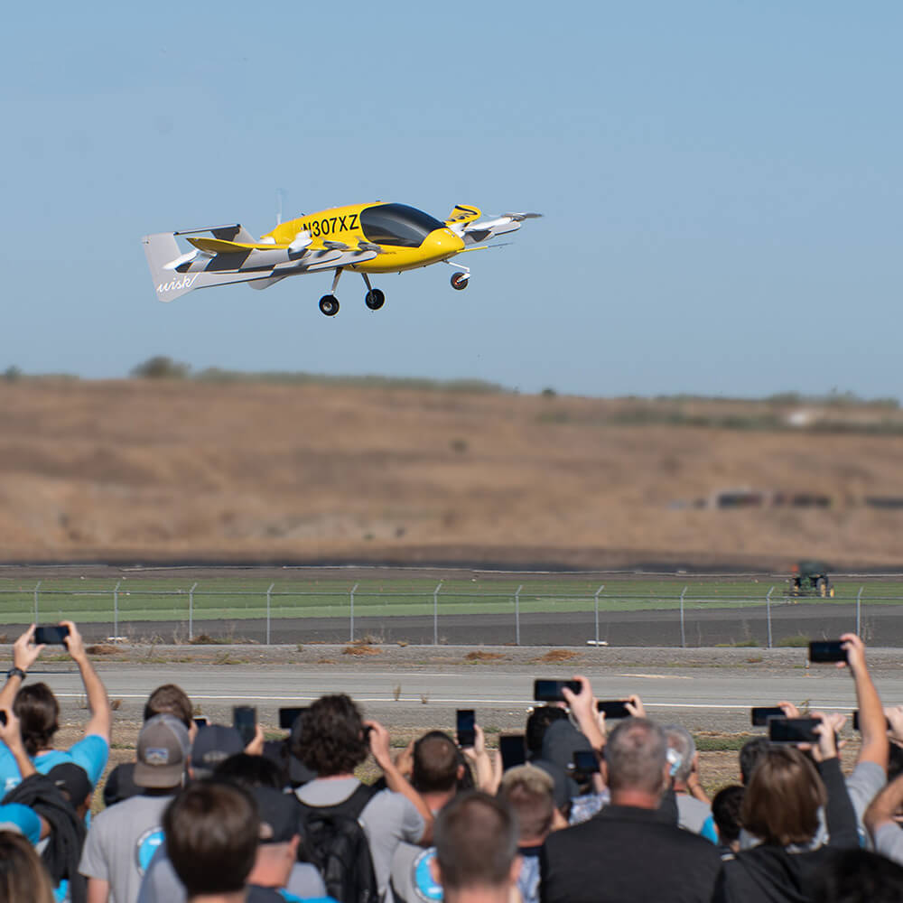 Ground crew monitors Cora during hover flight test
